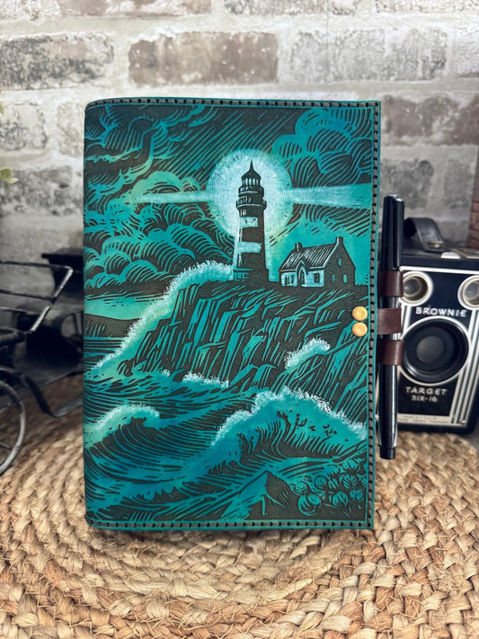 He Calmed the Storm Leather Journal – Tattooed Lighthouse & Storm Design